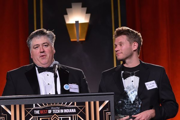 Mark Boxberger (left) and Wes Winham accept the 2014 Mira Award for excellence and innovation in health technology.
