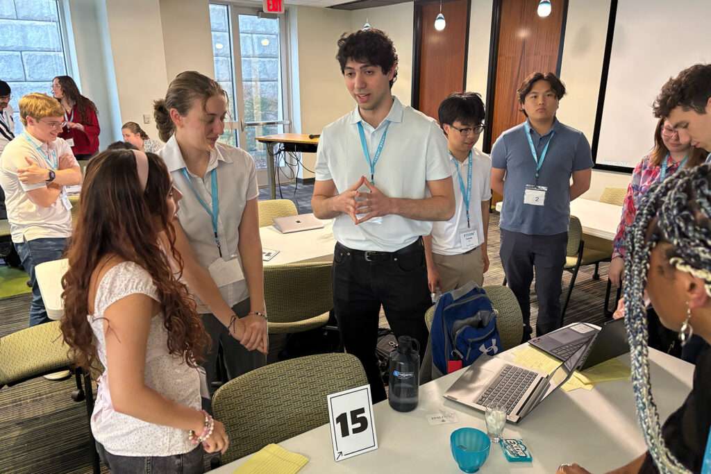 xterns discussing a project as part of their collaborative work