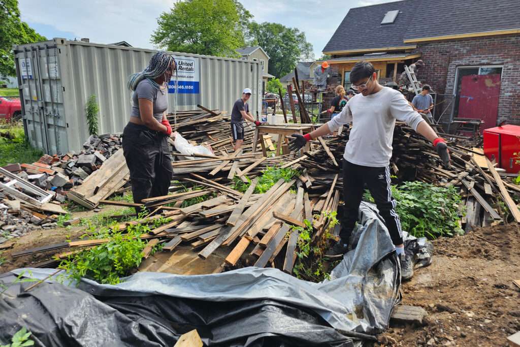 xterns participating in cleanup volunteer work at aspire house