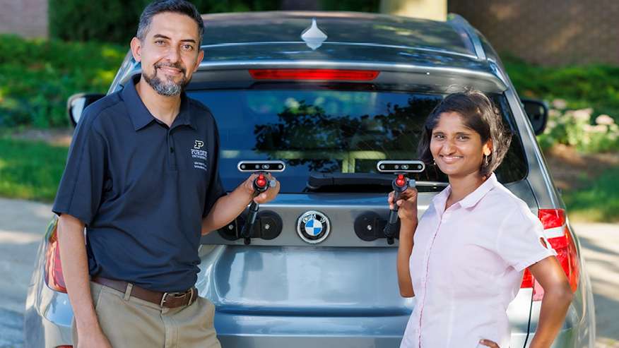 Mohammad Jahanshahi (left), founder and CEO of PaveX and associate professor in Purdue University’s College of Engineering, and Malle Kachireddy, PaveX team member and PhD student in Purdue University’s Elmore Family School of Electrical and Computer Engineering. (Purdue University photo/Kevin Crisp)