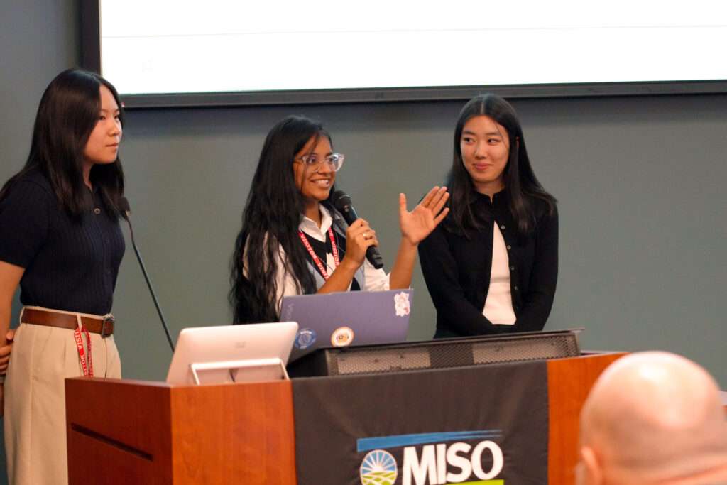 Kallista Zhang, Nakshatra Bobbili, and Ruth Sugiarto present on behalf of Team 1 at the TechPoint Xtern Challenge on October 10.
