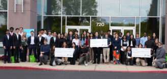 All 10 student teams from TechPoint’s 2025 Xtern Challenge pose together outside MISO headquarters in Carmel, Indiana. The photo includes the first-, second-, and third-place teams holding their award checks following the competition.