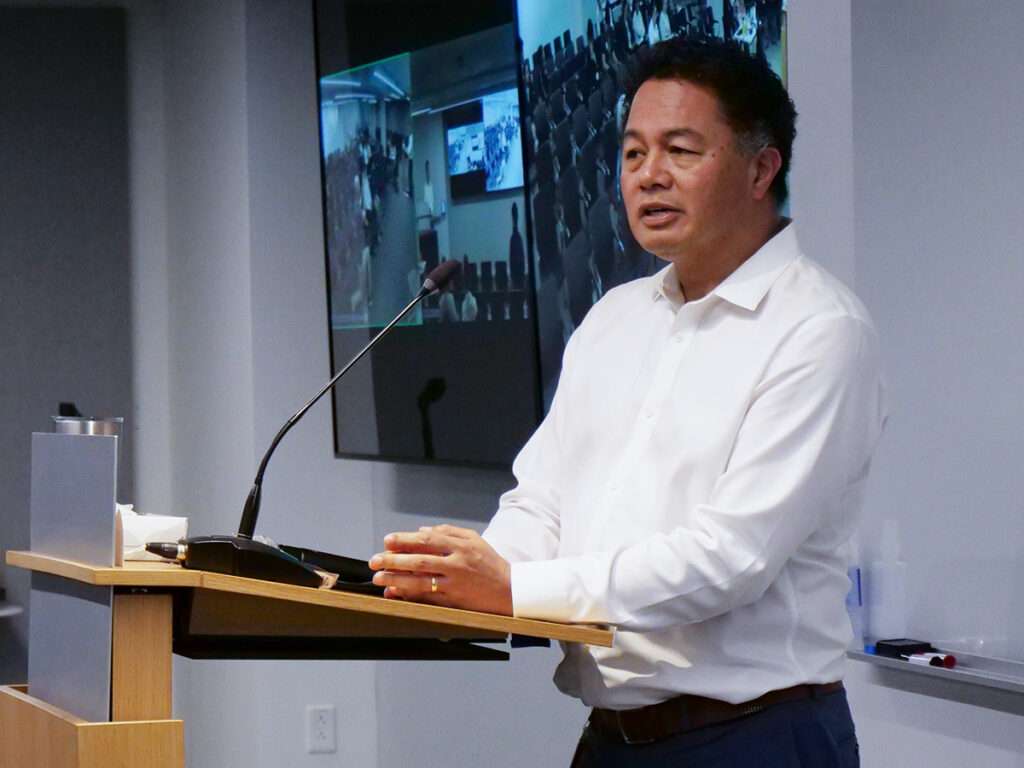 Paul Bautista of Cummins speaks at a podium during the 2026 Xtern Challenge.