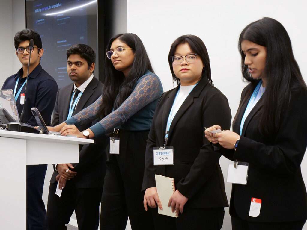 Team 5 presents during the 2026 Xtern Challenge. Team members are Vihaan Pradeep of Purdue University, Monish Malla of Indiana University Bloomington, Sahi Maldoddi of Indiana University Indianapolis, Quynh Tran of DePauw University, and Joshika Sathyamathan of Purdue University.