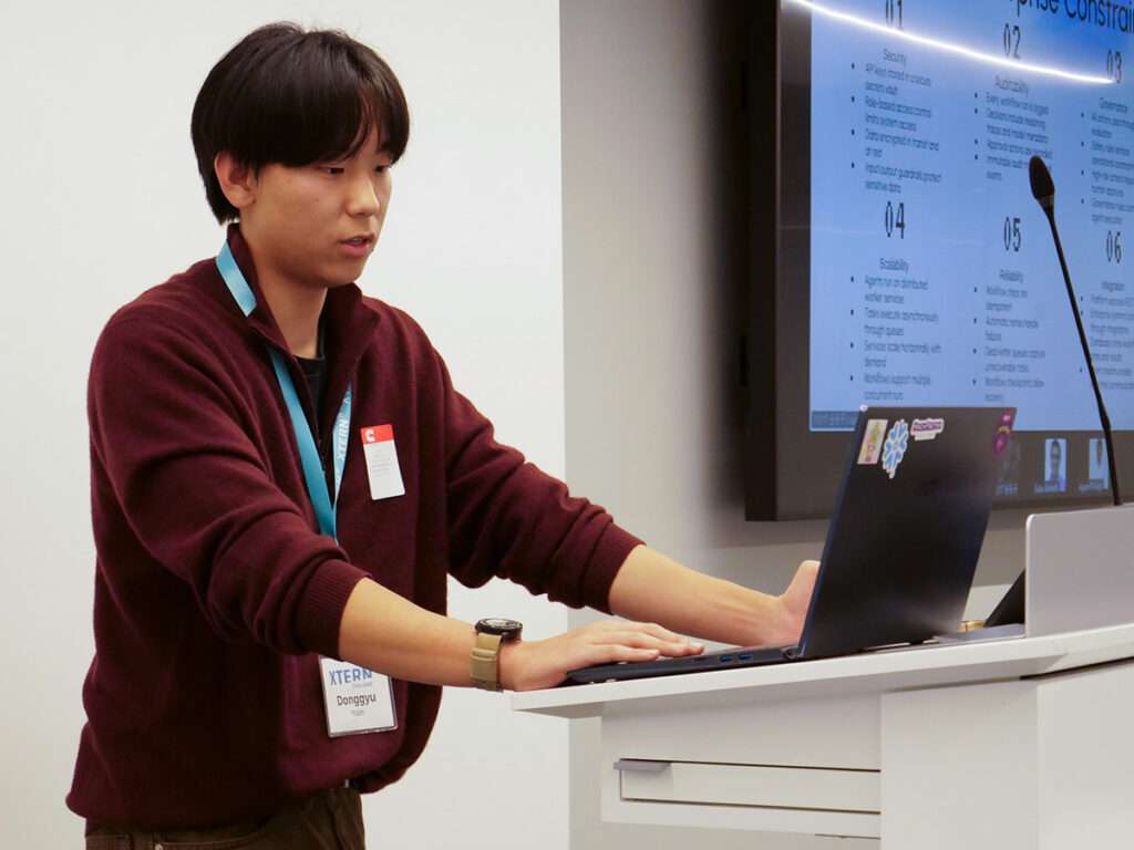 Donggyu Yoon presents for Team 6 during the 2026 Xtern Challenge.