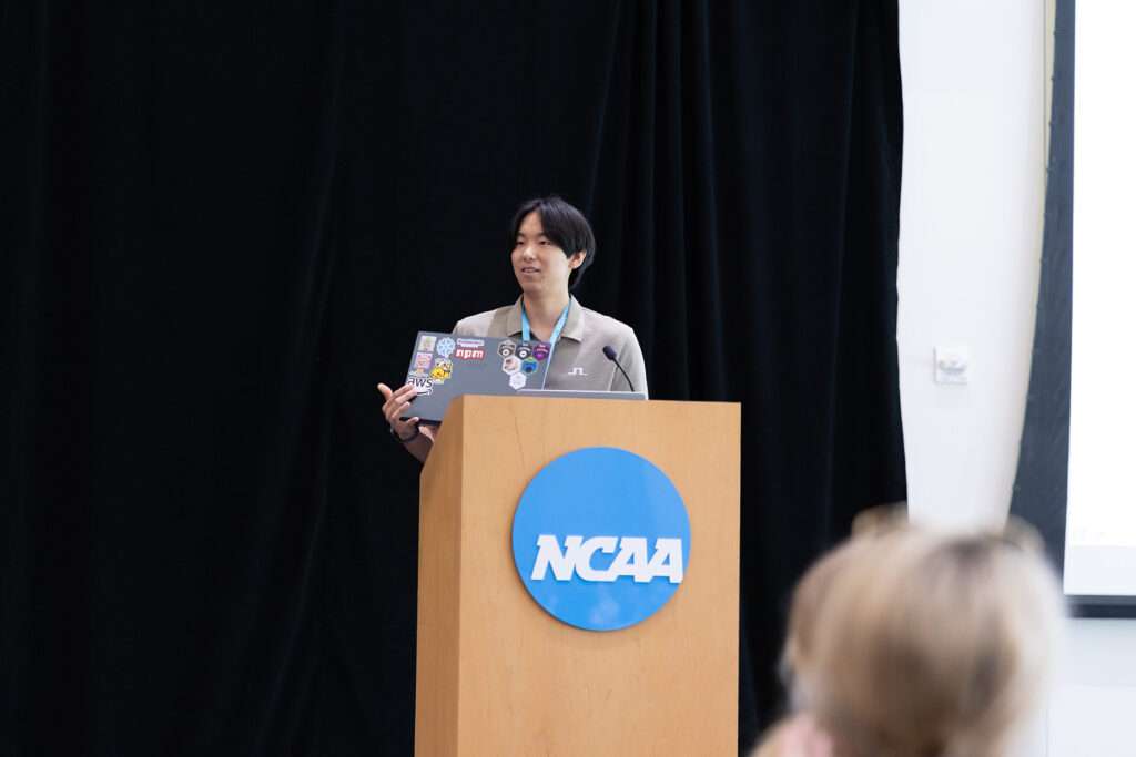 Donggyu Yoon speaks from a podium at the NCAA Hall of Champions during the 2026 XTERN Awards & Celebration.