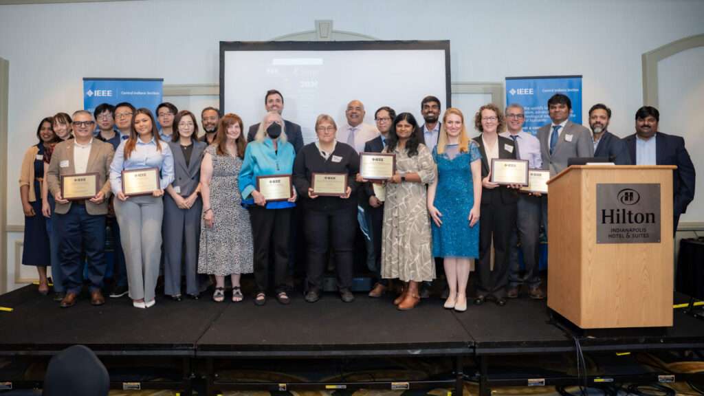 Honorees at the IEEE Central Section Awards Banquet pose with their awards.