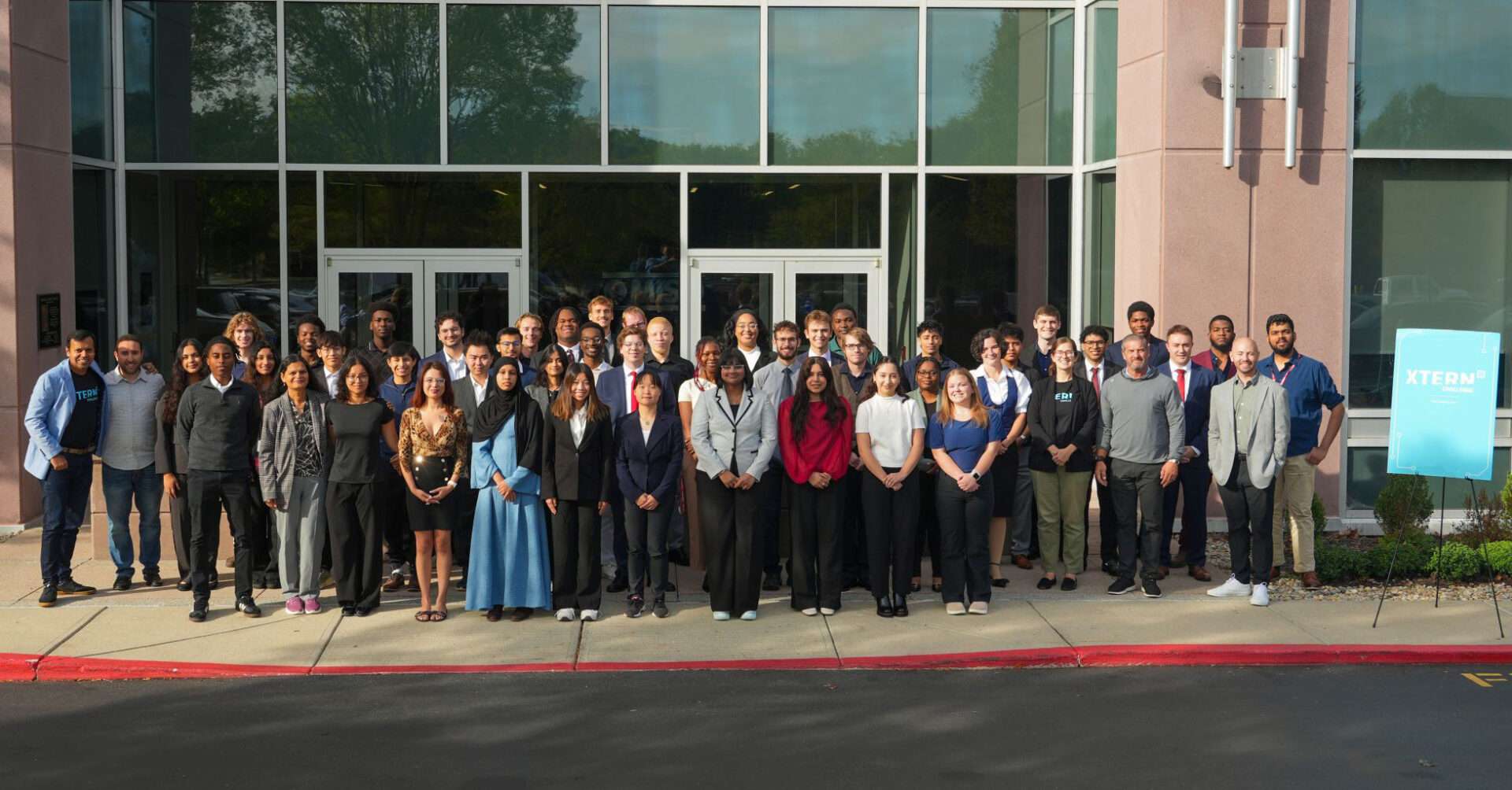 Group photo of 2026 MISO Xtern Challenge participants and staff gathered outside MISO’s Carmel headquarters.