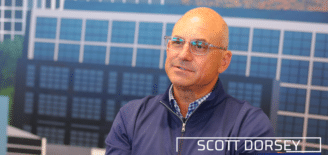 Scott Dorsey, 2027 honorary chair of the TechPoint Mira Awards, speaks during an interview with his name and title displayed on screen.