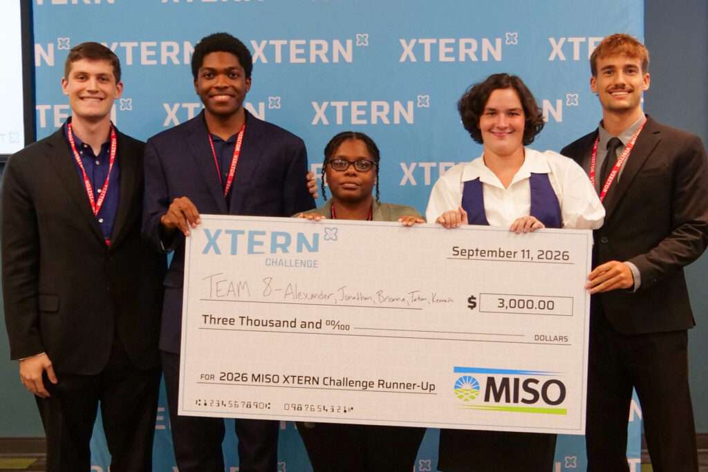 Team 8 poses with a $3,000 check after earning second place in the 2026 MISO Xtern Challenge.