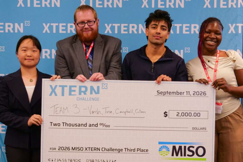 Team 3 poses with a $2,000 check after earning third place in the 2026 MISO Xtern Challenge.
